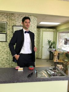 Men-Model-Black-Tuxedo-Fitted-White-Dress-Shirt-Black-Bow-Tie-Altered-Alteration-Tailored-Design-Fit-Check-Posing-Behind-Counter